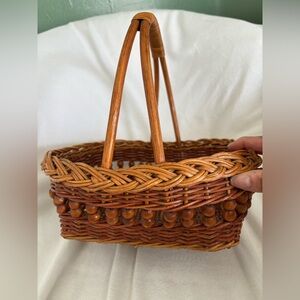 Vintage gathering wicker basket with wood beads and wrapped handle